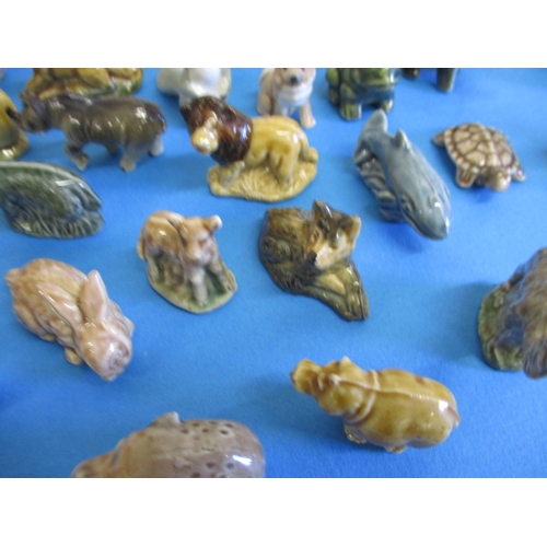 139 - A large collection of vintage miniature ceramic animals, most by Wade, all with no observed damage