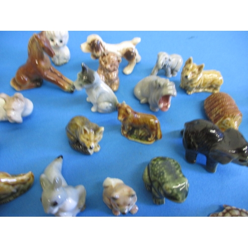 139 - A large collection of vintage miniature ceramic animals, most by Wade, all with no observed damage