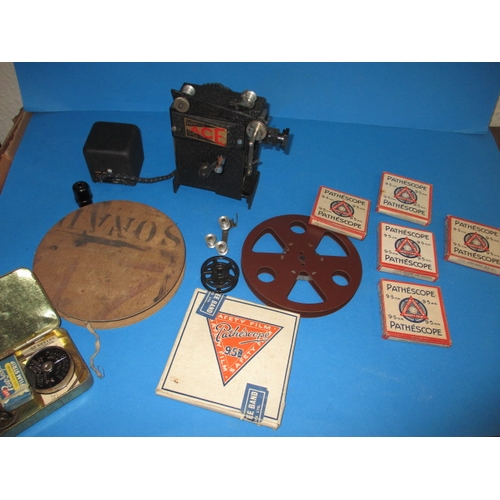 142 - A vintage Pathescope ACE 9.5mm projector and an assortment of films, all in untested used condition