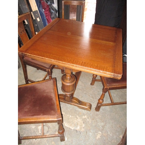 152 - A mid 20th Century oak drawer leaf table and 4 chairs. Size closed approximately 90 x 90cm, both lea... 