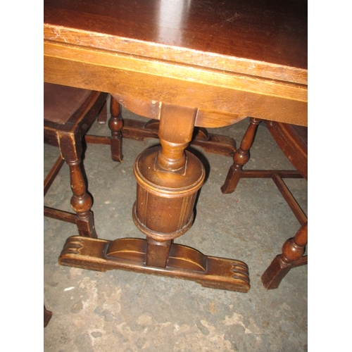 152 - A mid 20th Century oak drawer leaf table and 4 chairs. Size closed approximately 90 x 90cm, both lea... 