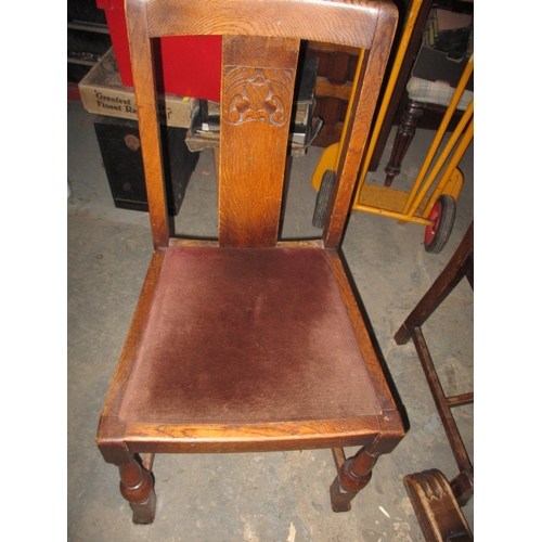 152 - A mid 20th Century oak drawer leaf table and 4 chairs. Size closed approximately 90 x 90cm, both lea... 