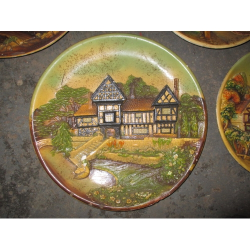 156 - A parcel of 1950’s plaster wall plaques, with country scenes, some minor damages. Approximate diamet... 