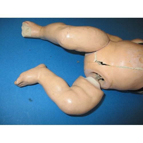 165 - A vintage German bisque head doll, damaged body and one arm missing, but head looks ok, approx. leng... 