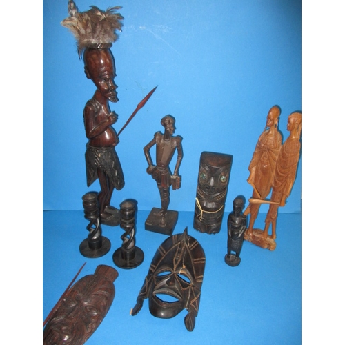 171 - A parcel of treen items, to include African figures and masks, one mask repaired, all in used condit... 