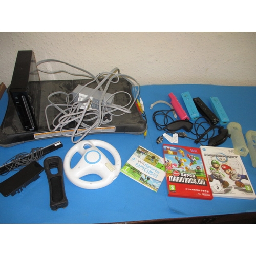 172 - A Nintendo WII and accessories, to include a balance board and controllers, all in used condition an... 