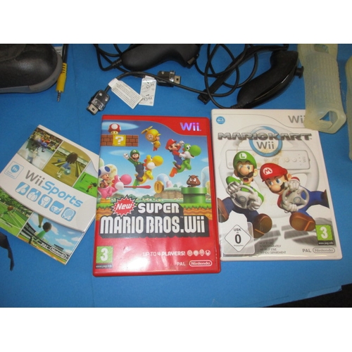 172 - A Nintendo WII and accessories, to include a balance board and controllers, all in used condition an... 