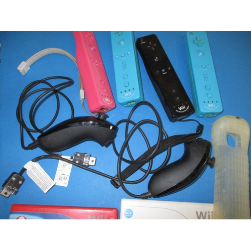 172 - A Nintendo WII and accessories, to include a balance board and controllers, all in used condition an... 