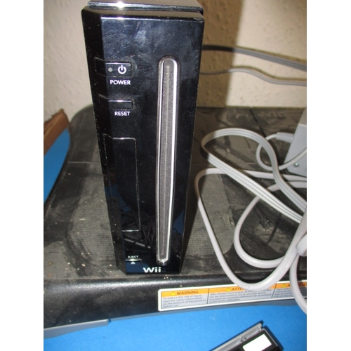 172 - A Nintendo WII and accessories, to include a balance board and controllers, all in used condition an... 