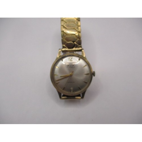 129 - A vintage Avia 9ct gold cased watch with steel expanding strap, in used condition and not running