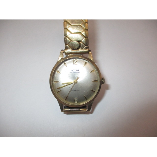 129 - A vintage Avia 9ct gold cased watch with steel expanding strap, in used condition and not running