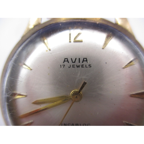 129 - A vintage Avia 9ct gold cased watch with steel expanding strap, in used condition and not running