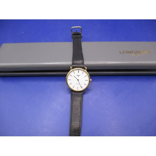 130 - A vintage Longines wrist watch, in original box and in working order, no paperwork and in good pre-o... 