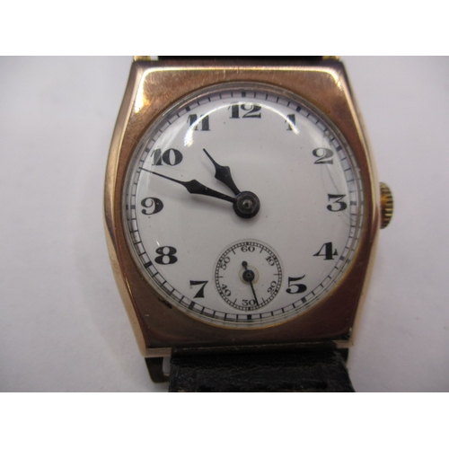 131 - A vintage 9ct gold cased wrist watch with leather strap, in working order with minor age-related mar... 