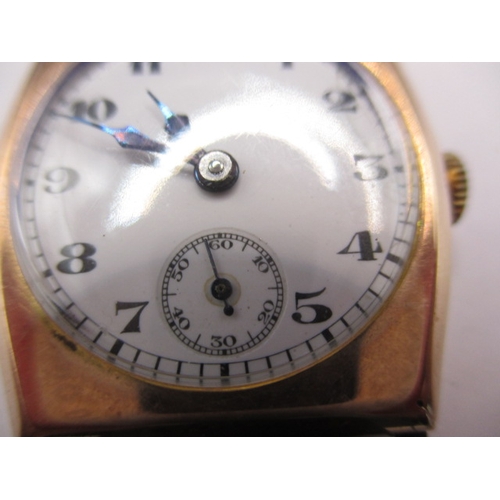 131 - A vintage 9ct gold cased wrist watch with leather strap, in working order with minor age-related mar... 