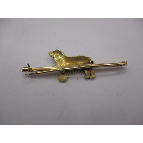 80 - A vintage 15ct gold and enamel bar brooch, having a spaniel in naturalistic coloured enamel, approx.... 