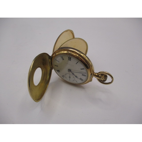 133 - A vintage 15ct gold cased half hunter pocket watch, runs when wound, having general use-related mark... 