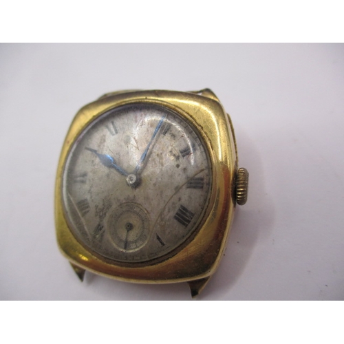 134 - A 1930s 18ct gold cased wrist watch, in well used condition, still runs when wound, no strap and gen... 