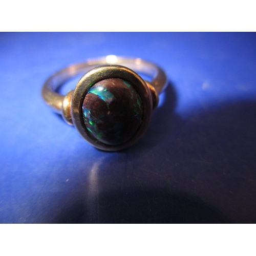 12 - A 9ct yellow gold ring with cabochon matrix opal, approx. ring size ‘P’, approx. weight 4.1g in good... 