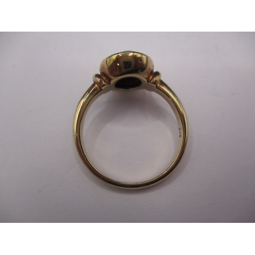 12 - A 9ct yellow gold ring with cabochon matrix opal, approx. ring size ‘P’, approx. weight 4.1g in good... 