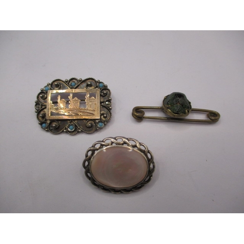 124 - 3 antique brooches one being silver and gold, and a scarab beetle example, all in used condition