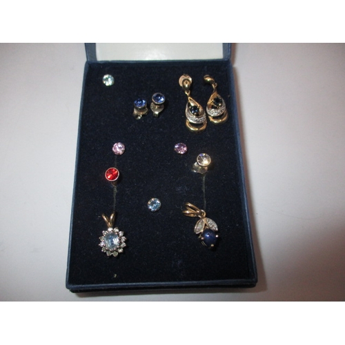 125 - A parcel of earrings and necklace pendants, some on 9ct gold, various stones, all in good used condi... 