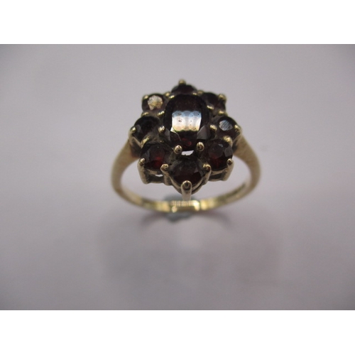 14 - A vintage 9ct gold garnet cluster ring, approx. ring size ‘P’, approx. weight 2.6g in good pre-owned... 