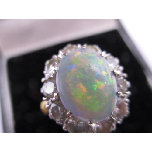 18 - An 18ct yellow gold diamond and opal ring, approx. ring size ‘K’ approx. weight 5.7g , approx. size ... 