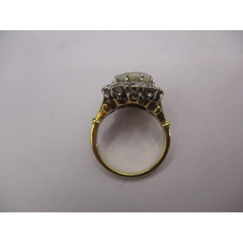 18 - An 18ct yellow gold diamond and opal ring, approx. ring size ‘K’ approx. weight 5.7g , approx. size ... 