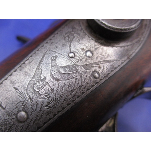 284 - A 19th century percussion muzzle loading double barrel shot gun by B Sturman, London. Having Damascu... 