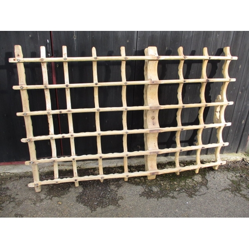 323 - An antique Eastern European Romany caravan front axle case, having been stripped to bare wood and us... 