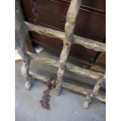 323 - An antique Eastern European Romany caravan front axle case, having been stripped to bare wood and us... 