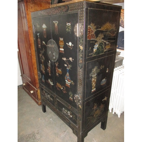 316 - An ebonised oriental style inlaid cupboard, with twin drawer lower section under shelved section, ap... 