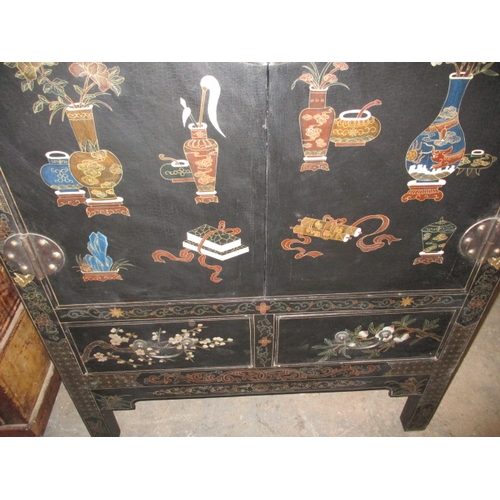 316 - An ebonised oriental style inlaid cupboard, with twin drawer lower section under shelved section, ap... 