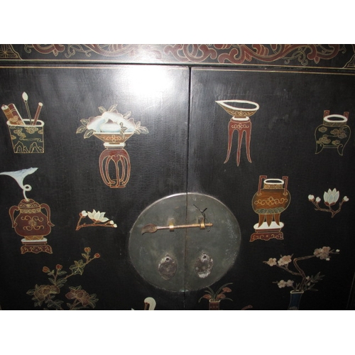 316 - An ebonised oriental style inlaid cupboard, with twin drawer lower section under shelved section, ap... 