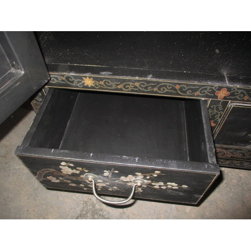 316 - An ebonised oriental style inlaid cupboard, with twin drawer lower section under shelved section, ap... 