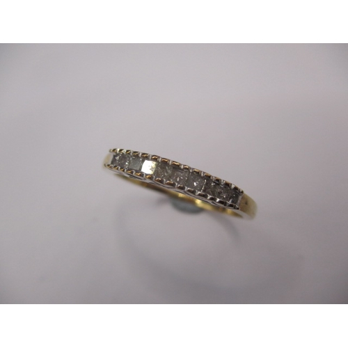 20 - A 9ct yellow gold ring with 10 square cut diamonds, approx. ring size ‘T’, approx. weight 2g in good... 