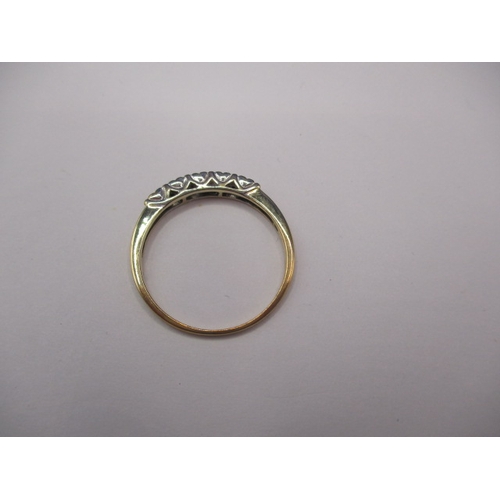 20 - A 9ct yellow gold ring with 10 square cut diamonds, approx. ring size ‘T’, approx. weight 2g in good... 