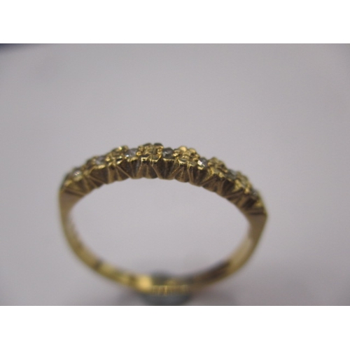 21 - A 9ct yellow gold ring set with 7 diamonds, approx. ring size ‘N+’ approx. weight 1.7g, in good pre-... 