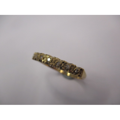 21 - A 9ct yellow gold ring set with 7 diamonds, approx. ring size ‘N+’ approx. weight 1.7g, in good pre-... 