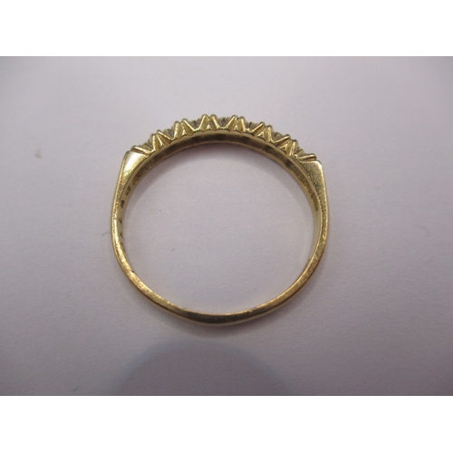 21 - A 9ct yellow gold ring set with 7 diamonds, approx. ring size ‘N+’ approx. weight 1.7g, in good pre-... 