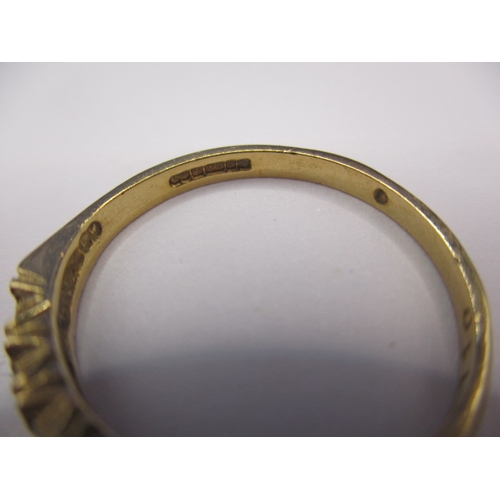 21 - A 9ct yellow gold ring set with 7 diamonds, approx. ring size ‘N+’ approx. weight 1.7g, in good pre-... 