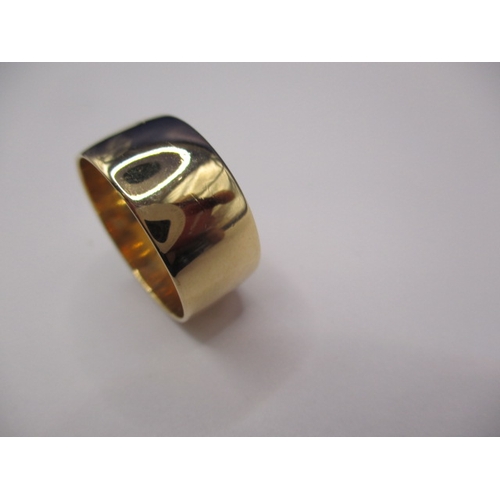 57 - A 9ct yellow gold wedding band, approx. ring size ‘P’ approx. width 10mm, approx. weight 5.5g, in go... 