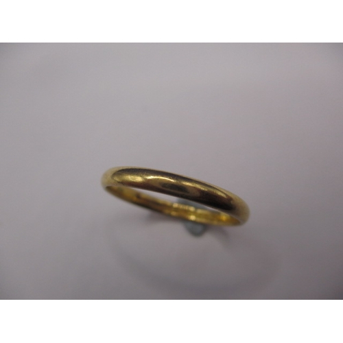 60 - A 22ct yellow gold wedding band, approx. ring size ‘M’, approx. width 2.5mm, approx. weight 1.9g in ... 