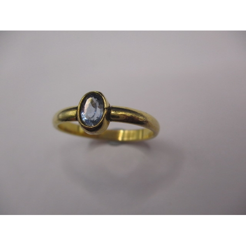 25 - An antique yellow gold ring with solitaire aquamarine, approx. ring size ‘N+’ unmarked and in good p... 