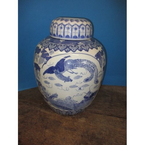 353 - A large oriental blue and white ceramic ginger jar and cover, approx. height 38cm in good pre-owned ... 