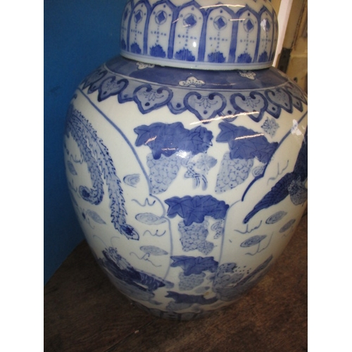 353 - A large oriental blue and white ceramic ginger jar and cover, approx. height 38cm in good pre-owned ... 