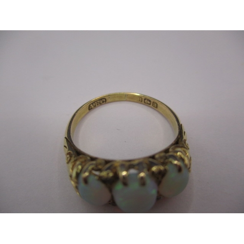 26 - An 18ct yellow gold ring with 3 natural cabochon opals, approx. ring size ‘O’, approx. weight 4.5g, ... 