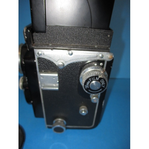 354 - A mid 20th century Yashica 635 camera, with additional telephoto lens, functions and has general use... 