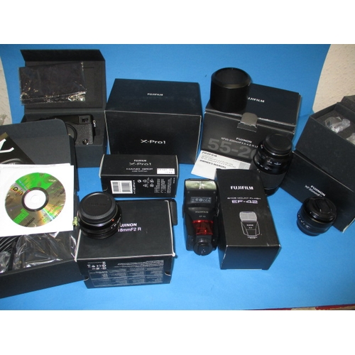 357 - A Fuji X-pro 1 digital camera body and numerous accessories, all assessed by WEX photo as 9+ conditi... 